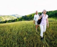 Caucasian couple hiking