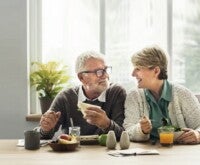 Couple talking over breakfast