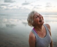 Female smiling with a background of sea