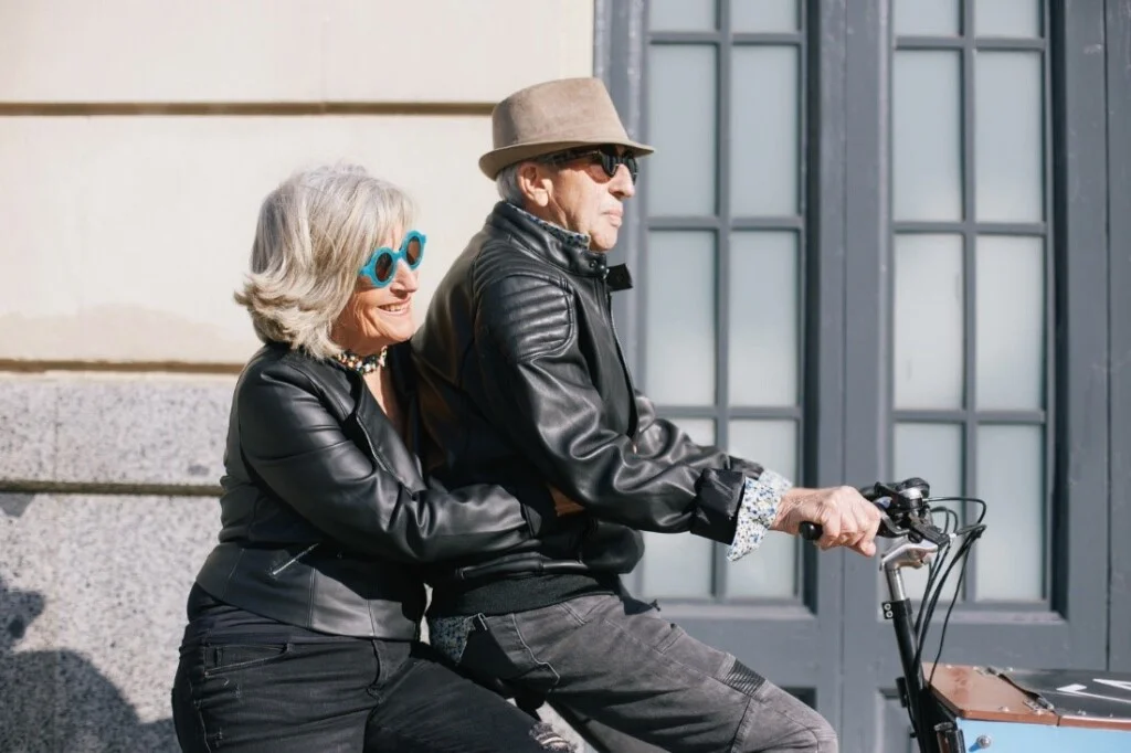Old couple riding a bike