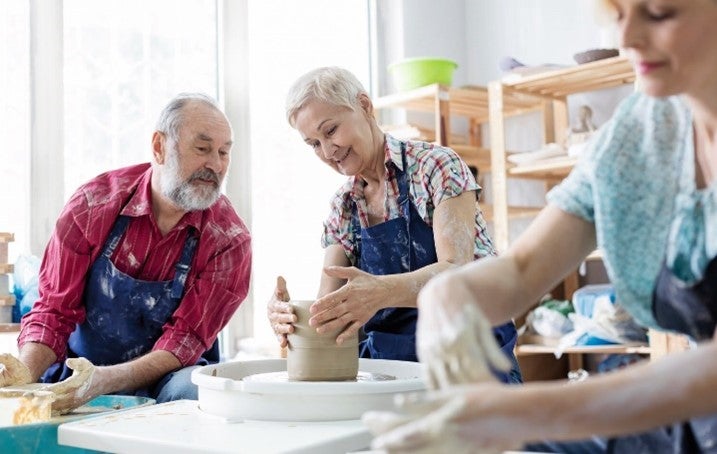 Couple making pottery