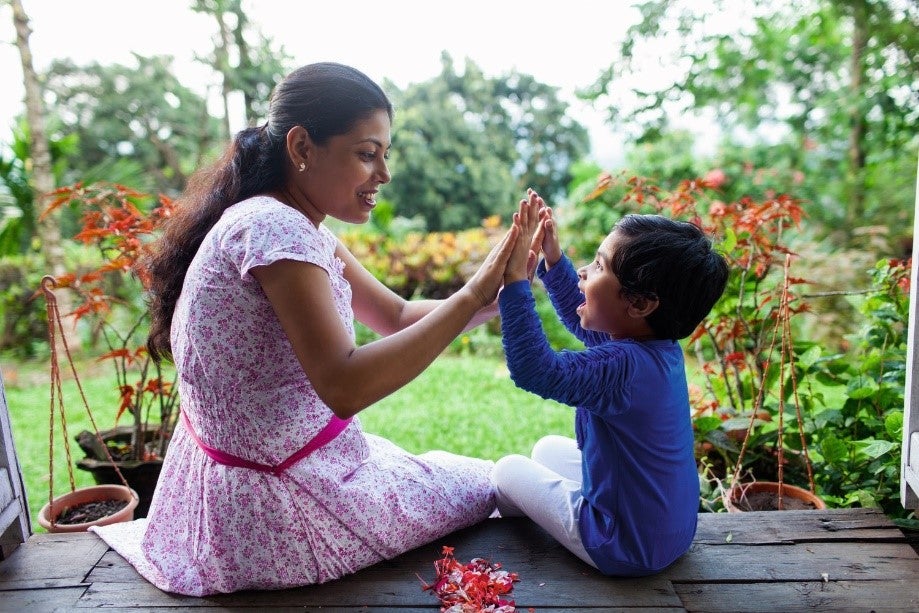 Woman playing with her child