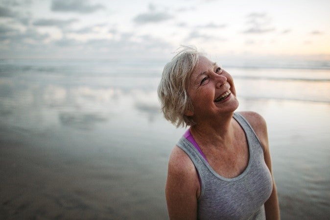 Female smiling with a background of sea